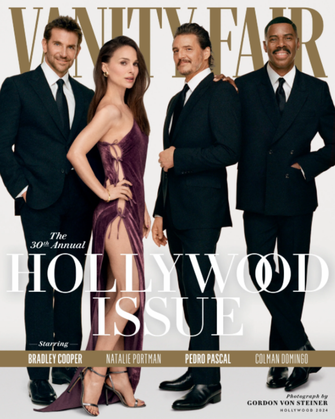 Hollywood-themed Vanity Fair magazine cover featuring four film stars styled in formal black suits and an evening dress.