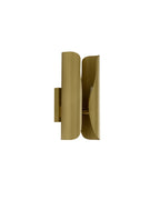 Sebastian wall sconce in brushed brass, shown from a side angle, featuring a sculptural curved double-panel design with a smooth, minimalist silhouette.