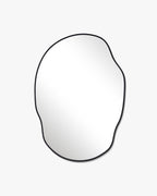 Irregular-shaped wall mirror with a slim black metal frame on a white background.