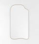 Asymmetrical full-length mirror with an organic shape and thin brass-colored frame on a white background.