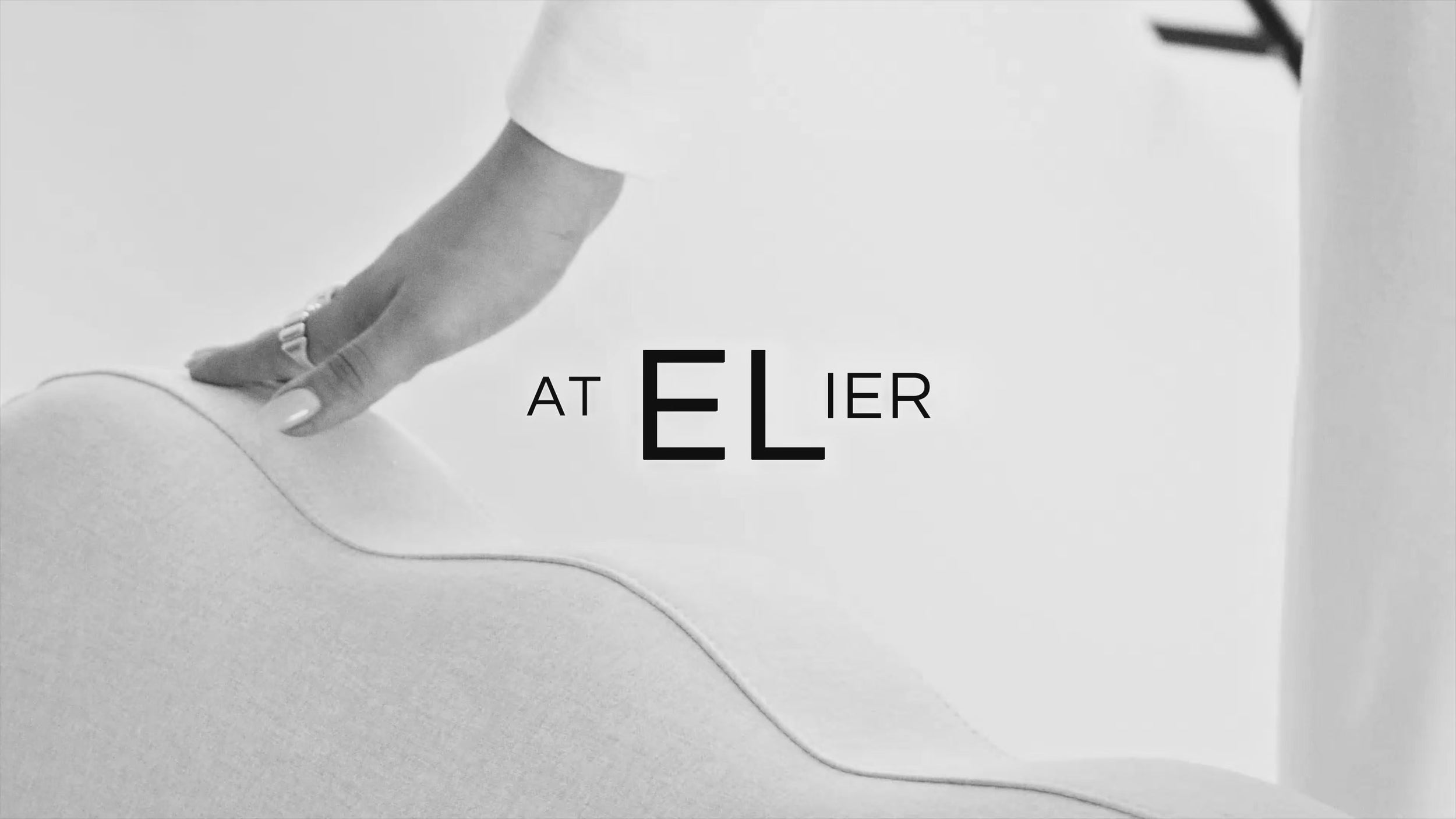 A black-and-white editorial video showcasing multiple Atelier collection products together.